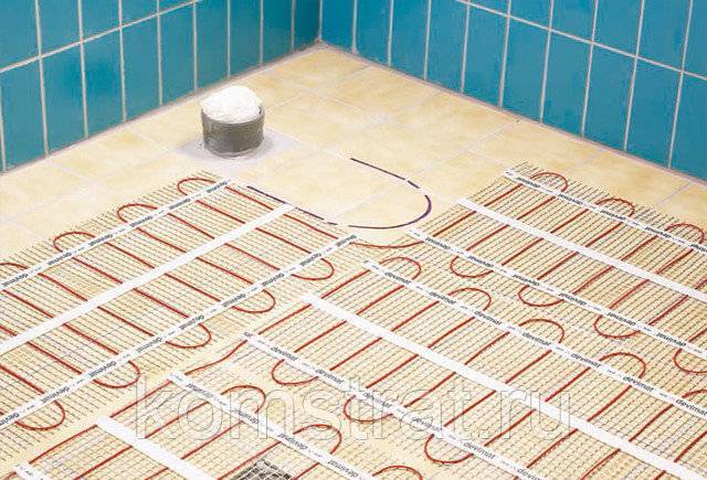 Как сделать электрический теплый пол в ванной под плитку – виды и технология монтажа
